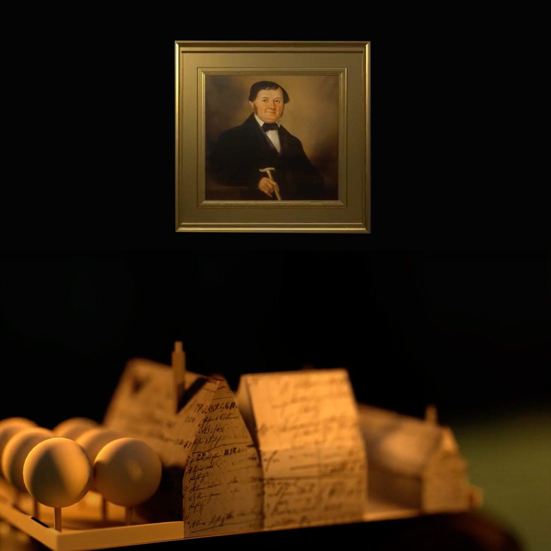Friedrich Koch und ein Modell des Rodensteiner Hofs in Oppenheim